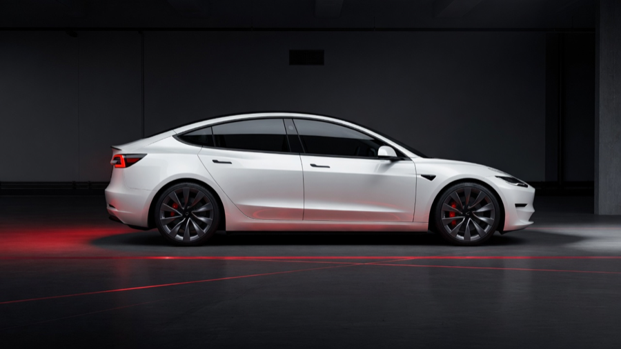White Tesla Model 3 side profile